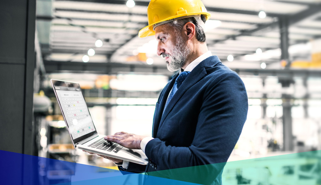 Factory worker with laptop