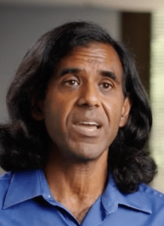 A Sr. Reliability Engineer at DuPont with long hair in a blue shirt.