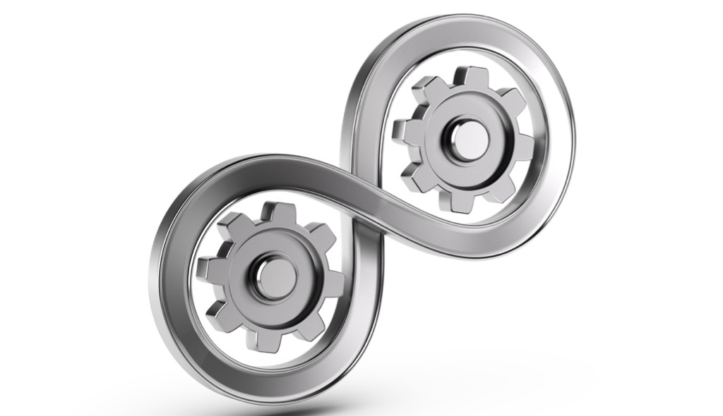 continuous progress in insight-driven manufacturing as represented by image of infinity loop with gears