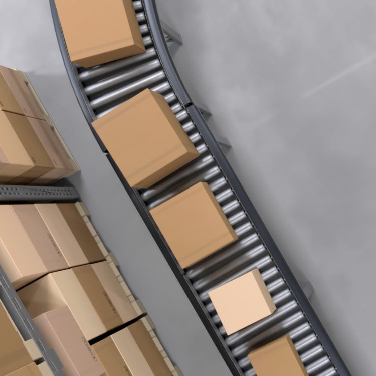 A conveyor belt transporting consumer packaged goods in boxes.