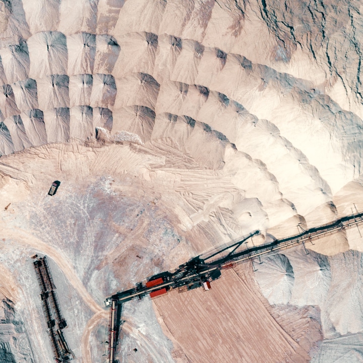 An aerial view of a sand pit in the mining industry.