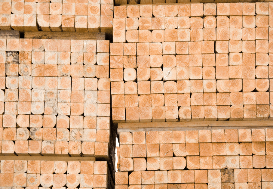 A stack of logs stacked on top of each other, overseen by a Regional Reliability Manager.