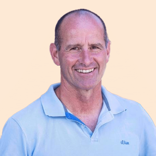 A man in a blue polo named Adi Segal smiles for the camera.