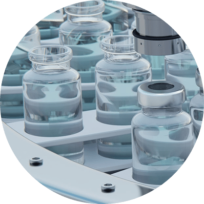 Close-up of several clear glass vials with metallic caps arranged in a circular pattern on an automated production line, likely in a pharmaceutical or laboratory setting.