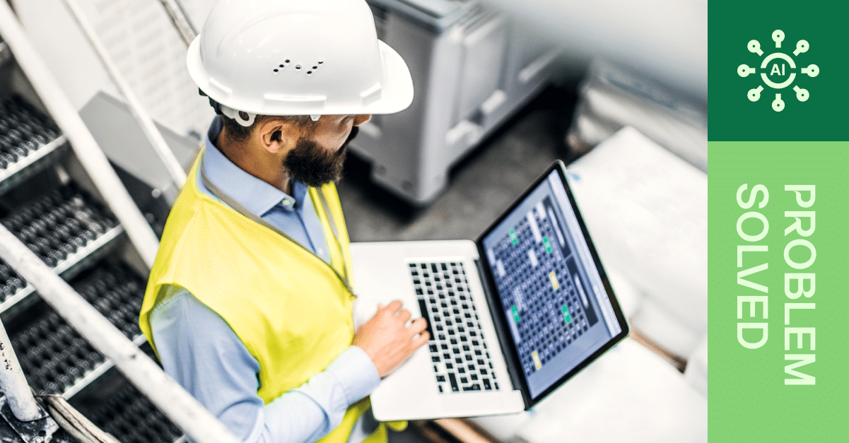 Man looking at laptop in factory: "Problem solved!"