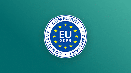 A blue and white badge with yellow stars in a circle reads EU GDPR in the center and COMPLIANT in white text repeated around the edge, symbolizing compliance with EU data protection regulations, on a teal background.
