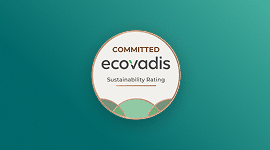 A circular badge with the words Committed Ecovadis Sustainability Rating on a green gradient background, signifying commitment to sustainability.