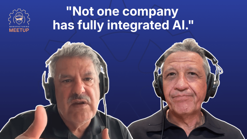 Two men wearing headphones speak in front of a blue background with the text: Not one company has fully integrated manufacturing AI. A Manufacturing Meetup logo is visible in the corner.