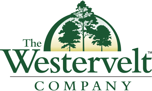 Logo for The Westervelt Company featuring green text with three silhouetted pine trees inside a semicircle above the word Westervelt. The company name appears in bold green letters below the trees.