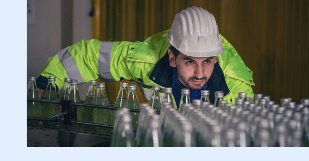 A manufacturing plant worker overseeing the progress of an active production line.
