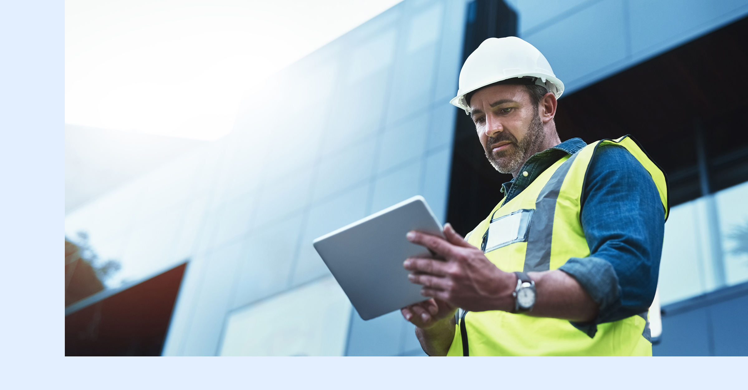 A reliability leader reviewing manufacturing costs on a tablet.